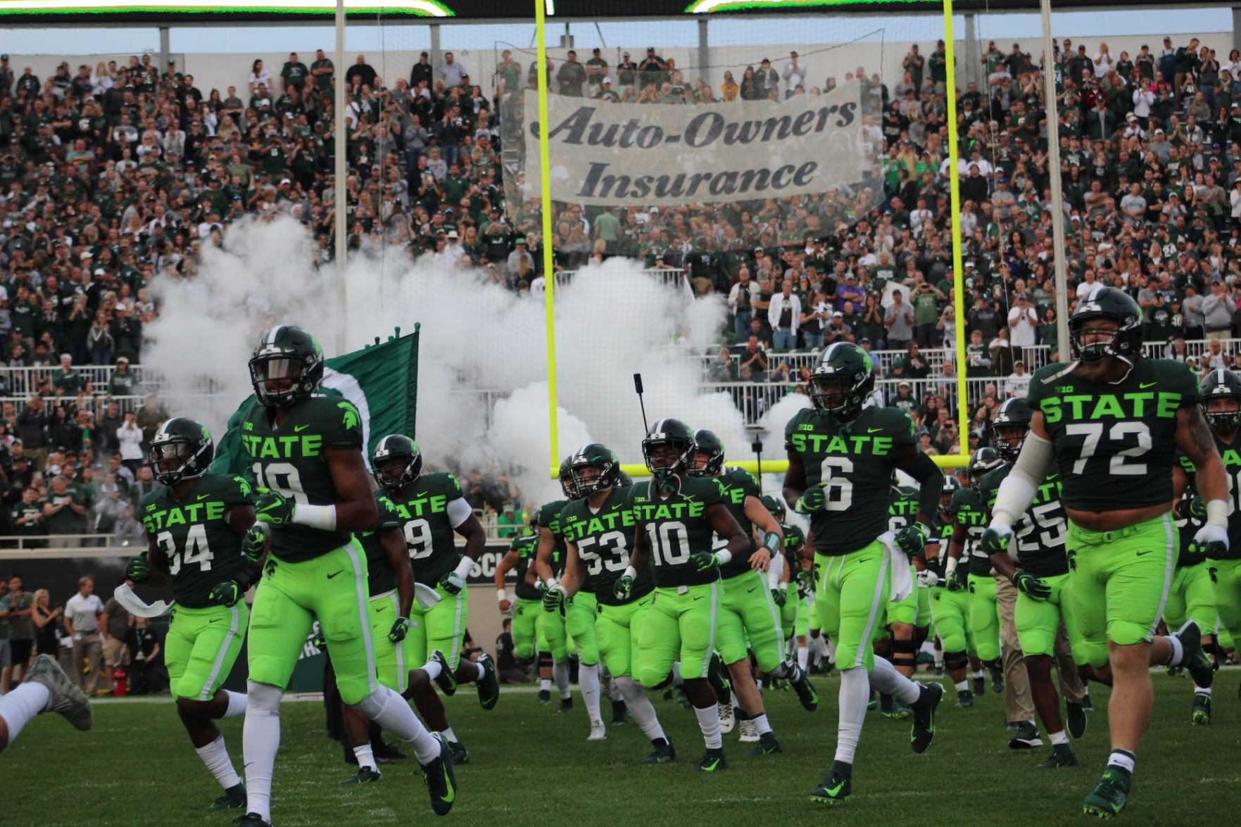 Spartan fans react to those infamous lime green pants and "STATE" script.